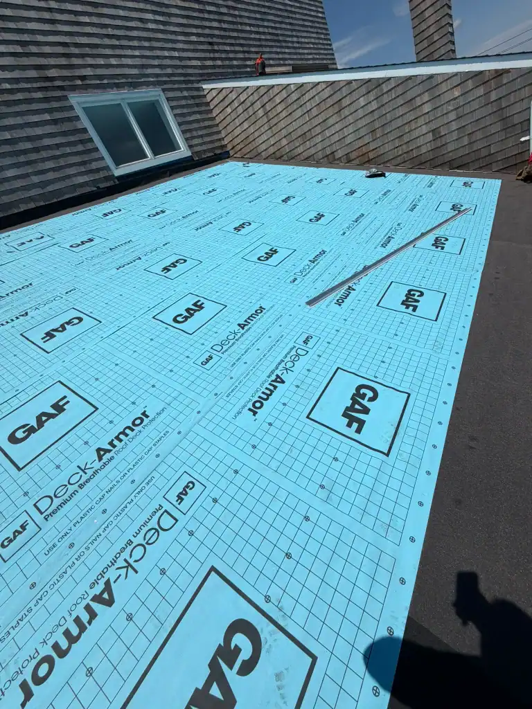 Roof under construction with GAF Deck-Armor waterproofing membrane installed.